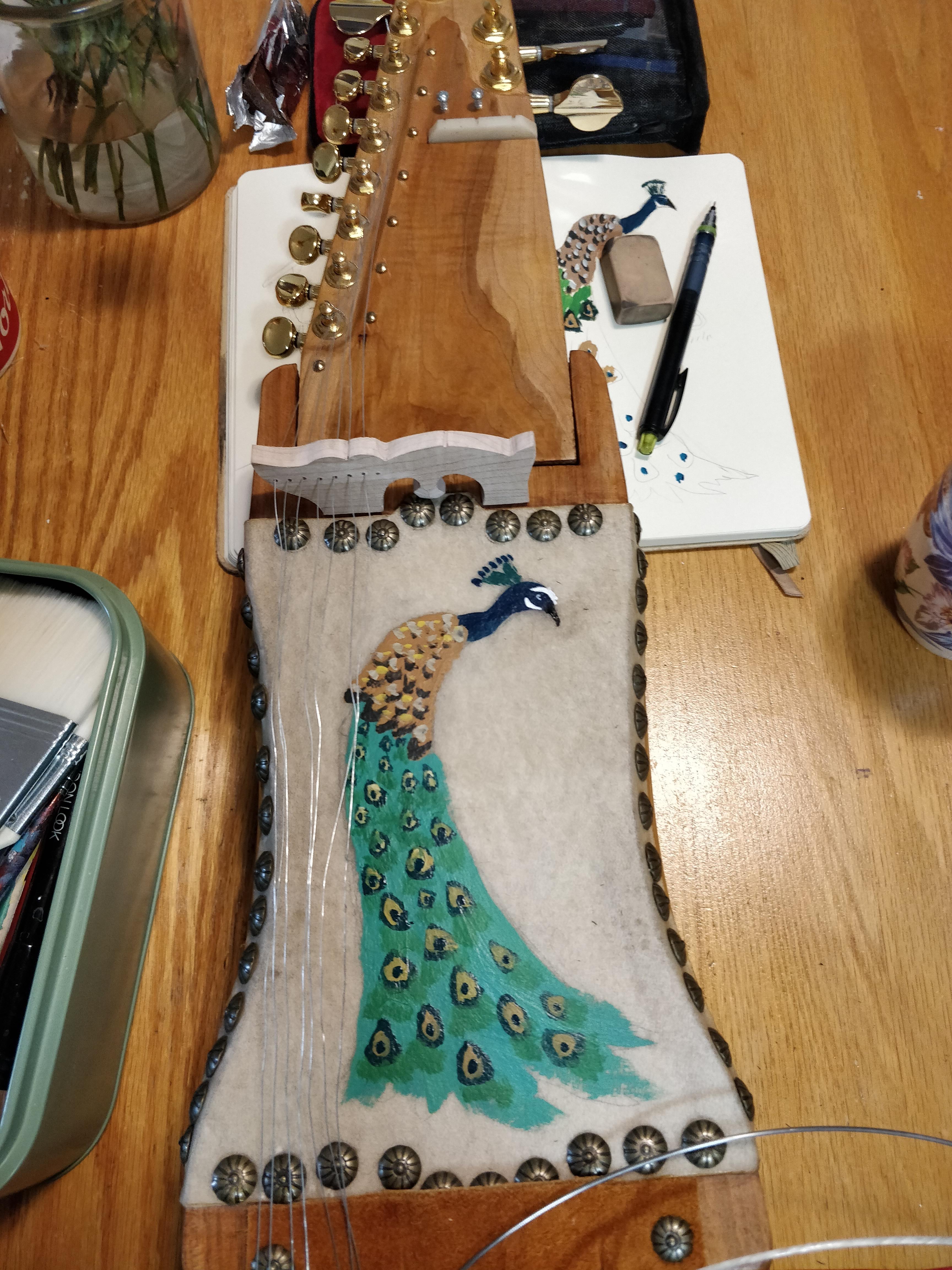 Sarangi with peacock painted on the skin.